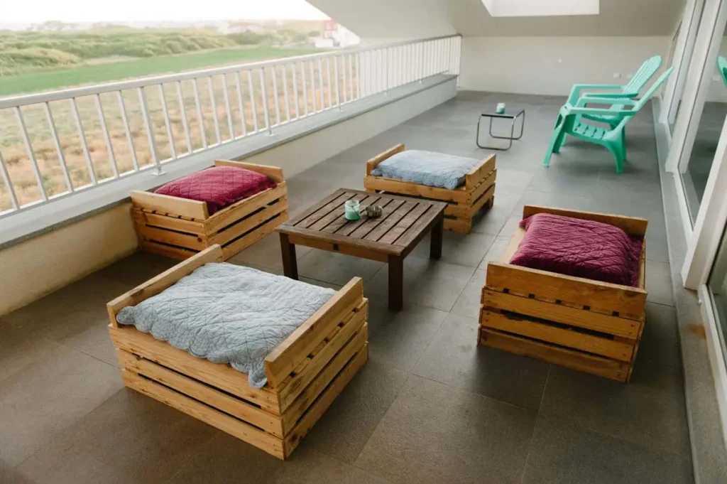Coffee tables and chairs on balcony.
