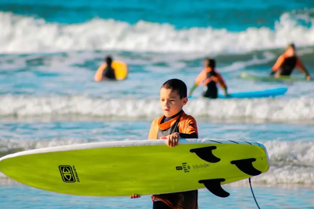 Kids surfing lesson at Secret Surf School.
